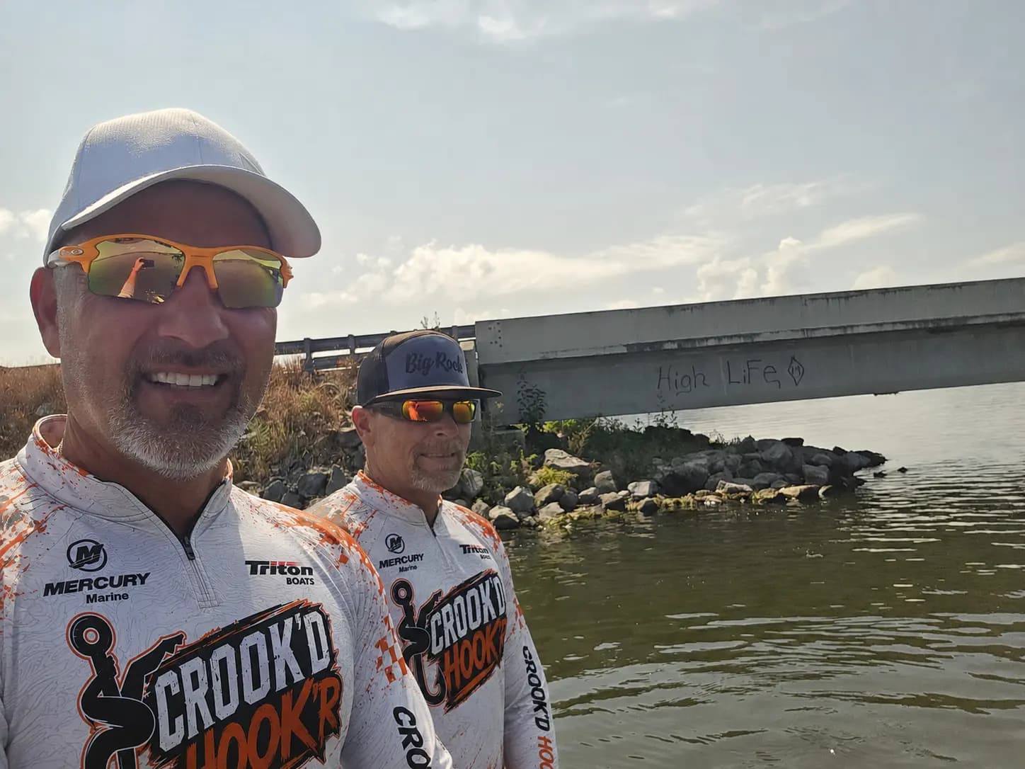 Matt and T under a bridge on Lake Guntersville
