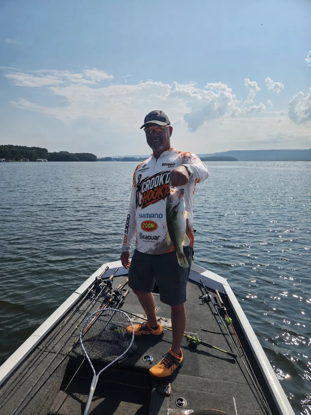 Matt holding a keeper largemouth on Lake Guntersville