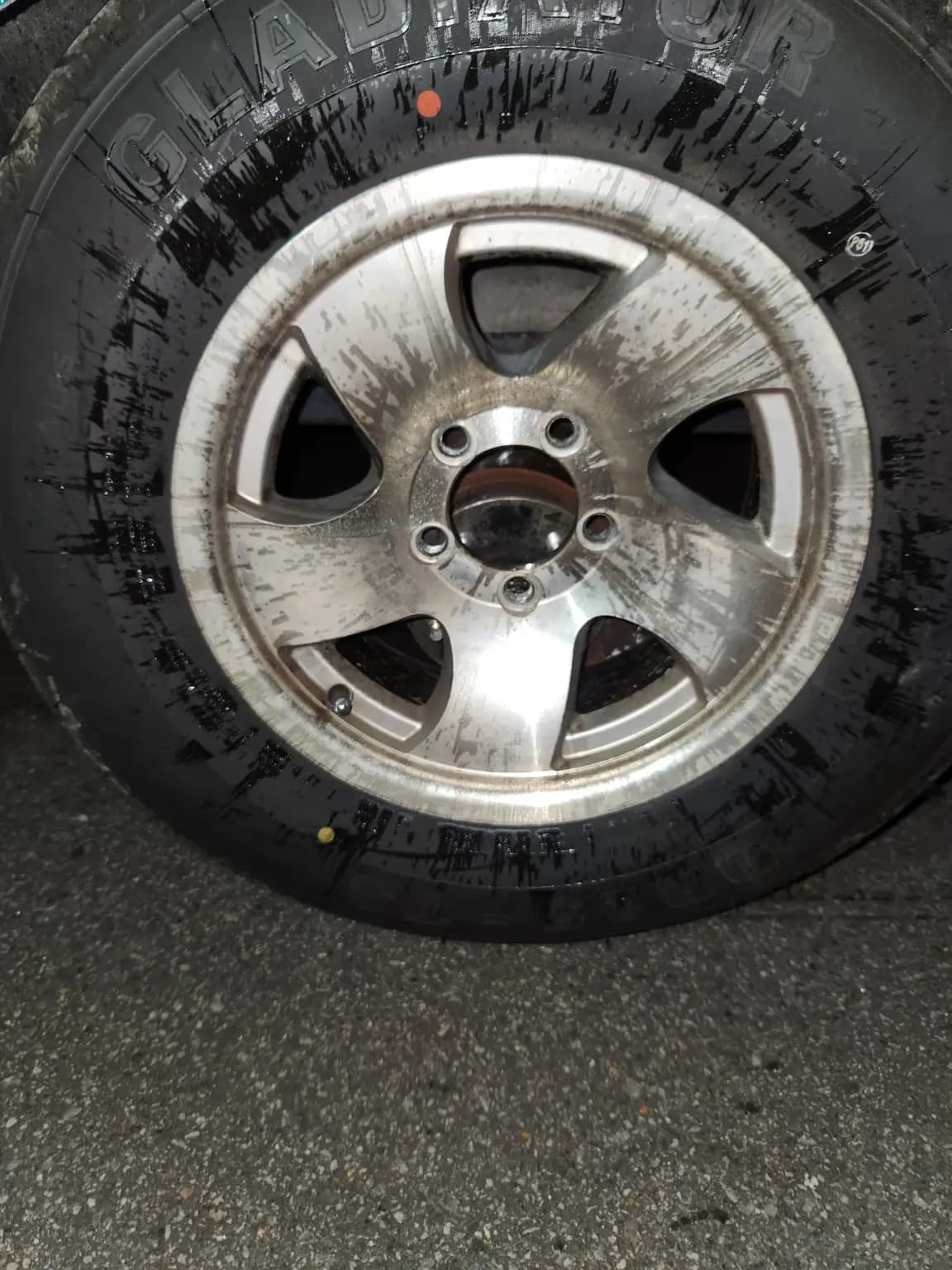 Damaged trailer wheel and tire after the roadside failure