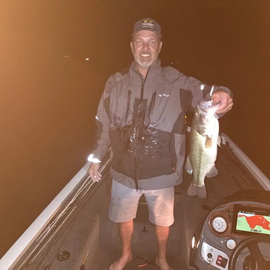 Matt holding a largemouth at night on Chickamauga Lake